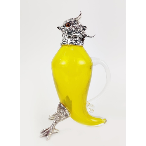 381 - CLARET JUG, in the form of a parrot, polished metal and yellow glass, 27cm H.