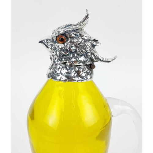 381 - CLARET JUG, in the form of a parrot, polished metal and yellow glass, 27cm H.