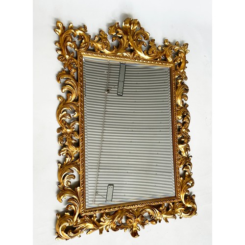 180 - WALL MIRROR, Italian 19th century Florentine carved giltwood with rectangular foliate and pierced fr... 