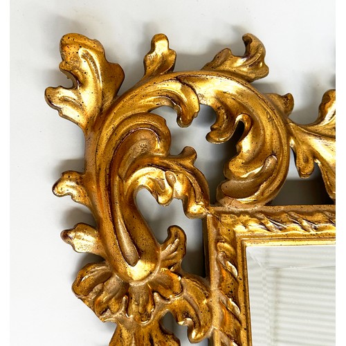 180 - WALL MIRROR, Italian 19th century Florentine carved giltwood with rectangular foliate and pierced fr... 