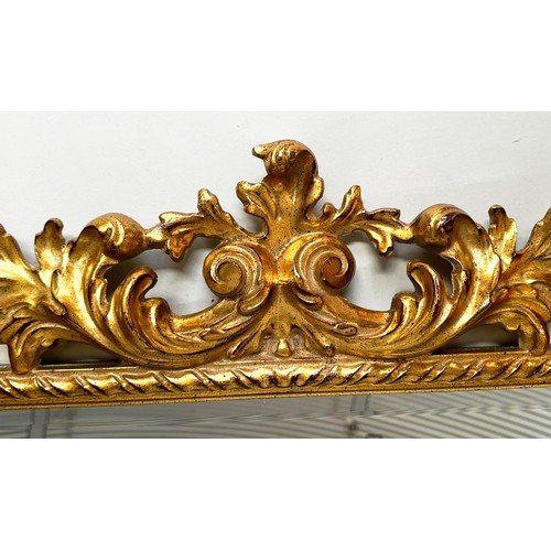 180 - WALL MIRROR, Italian 19th century Florentine carved giltwood with rectangular foliate and pierced fr... 