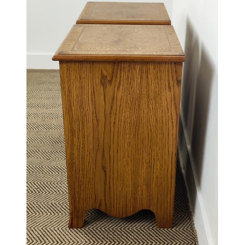 158 - BEDSIDE CHESTS, a pair, Victorian style oak with brushing slide over three graduated drawers, 66cm H... 