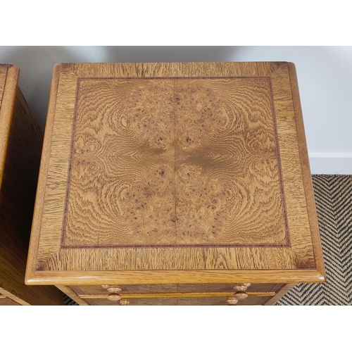 158 - BEDSIDE CHESTS, a pair, Victorian style oak with brushing slide over three graduated drawers, 66cm H... 