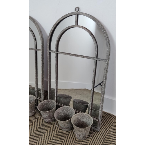 372 - GARDEN MIRRORS, a pair, metal arched frames, each with three plant pot holders, 90cm H x 45cm W. (2)