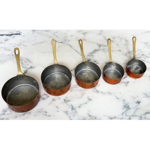 192 - COPPER PANS, a set of five small copper sauce pans, largest 10cm. (5)