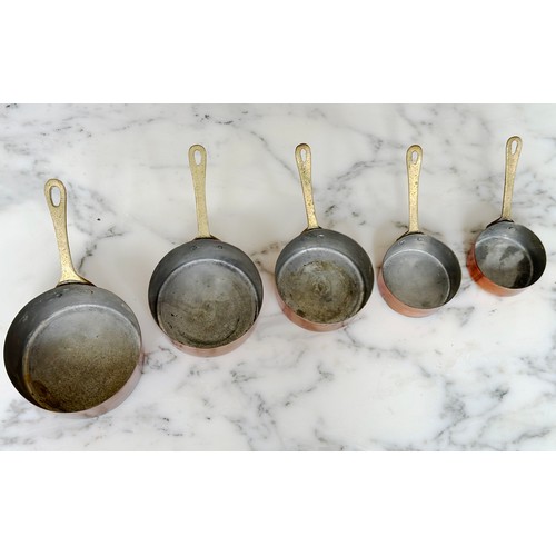 192 - COPPER PANS, a set of five small copper sauce pans, largest 10cm. (5)