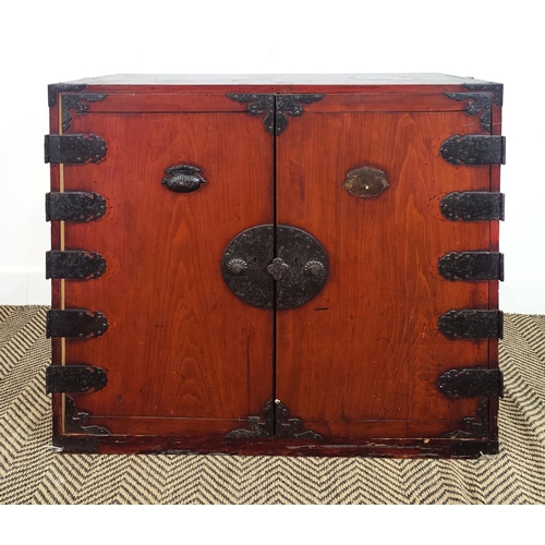 168 - JAPANESE CABINET, late 19th century stained firwood and iron mounted, with a pair of doors enclosing... 