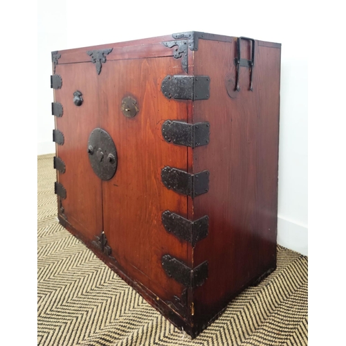 168 - JAPANESE CABINET, late 19th century stained firwood and iron mounted, with a pair of doors enclosing... 