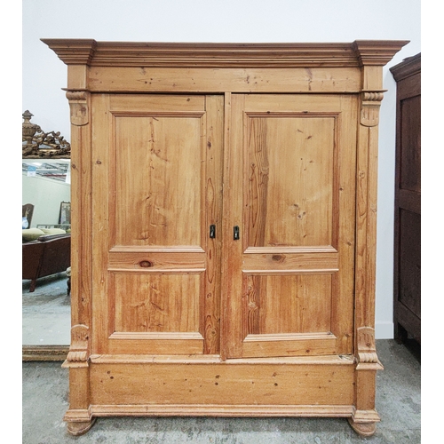 139 - PINE ARMOIRE, 19th century German, with a pair of panelled doors enclosing a hanging rail and shelf,... 