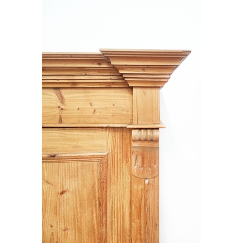 139 - PINE ARMOIRE, 19th century German, with a pair of panelled doors enclosing a hanging rail and shelf,... 