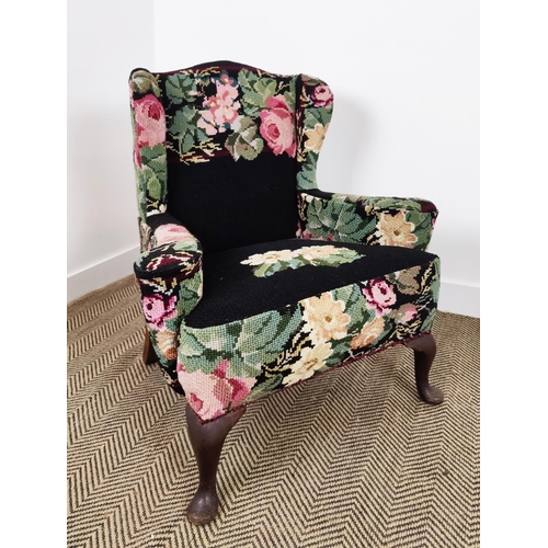 146 - WING ARMCHAIR, early 20th century mahogany in black needlework upholstery, 92cm H x 78cm W x 68cm D.