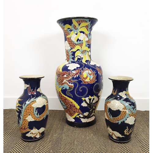 151 - VASES, three Chinese blue and yellow ceramic comprising one large, 82cm H, and a smaller pair, 41cm ... 