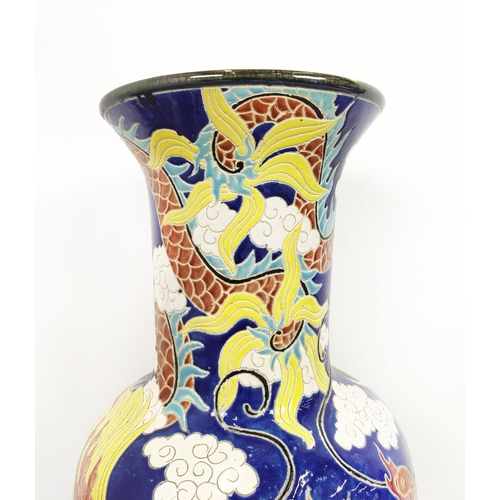 151 - VASES, three Chinese blue and yellow ceramic comprising one large, 82cm H, and a smaller pair, 41cm ... 