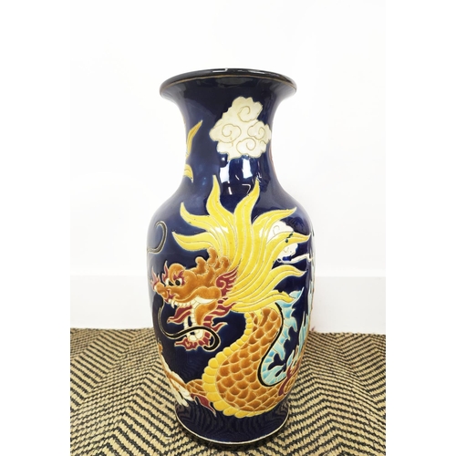 151 - VASES, three Chinese blue and yellow ceramic comprising one large, 82cm H, and a smaller pair, 41cm ... 