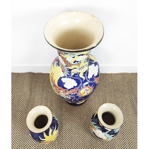 151 - VASES, three Chinese blue and yellow ceramic comprising one large, 82cm H, and a smaller pair, 41cm ... 