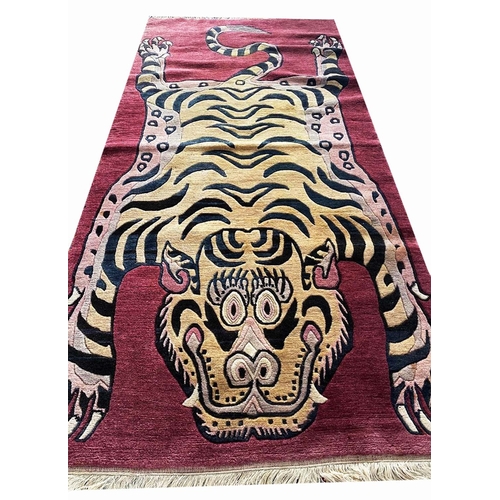 103 - TIBETAN TIGER RUG, 220cm x 95cm.