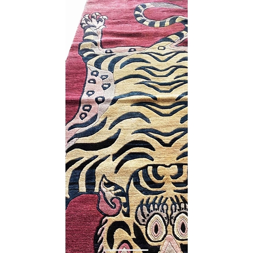 103 - TIBETAN TIGER RUG, 220cm x 95cm.