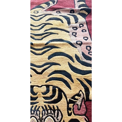 103 - TIBETAN TIGER RUG, 220cm x 95cm.