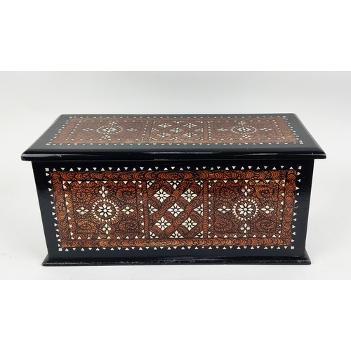 122 - BOX, ebonised, decorated and mother of pearl inlaid, 22cm H x 49cm W x 22cm D.