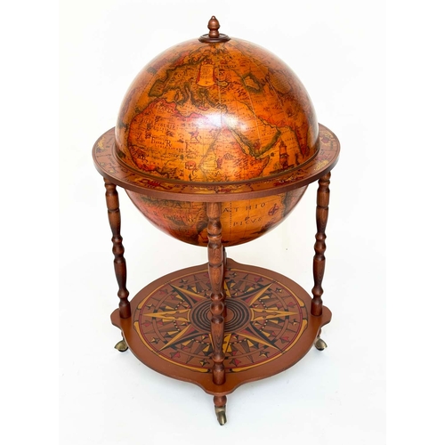 131 - GLOBE COCKTAIL CABINET, in the form of an antique terrestrial globe with rising lid and fitted inter... 