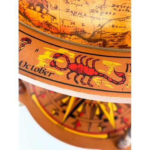 131 - GLOBE COCKTAIL CABINET, in the form of an antique terrestrial globe with rising lid and fitted inter... 