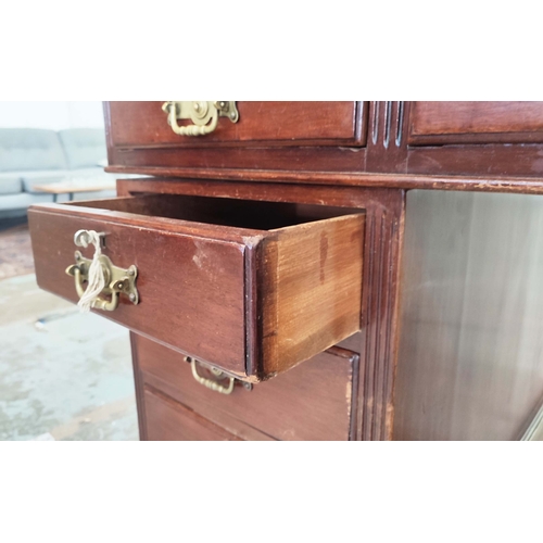 135 - PEDESTAL DESK, Edwardian mahogany with green leather top above nine drawers on castors, 76cm H x 153... 