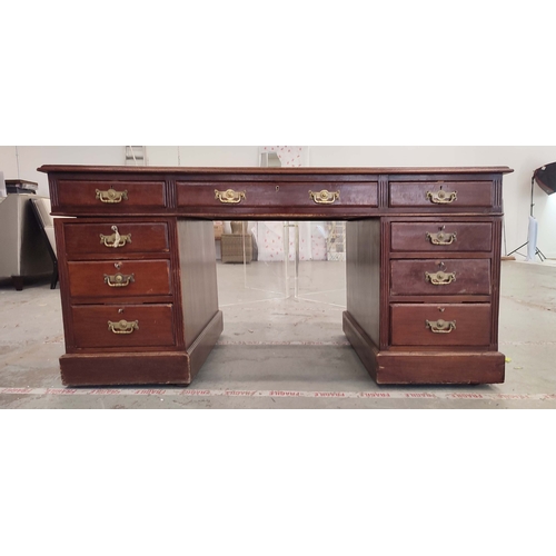 135 - PEDESTAL DESK, Edwardian mahogany with green leather top above nine drawers on castors, 76cm H x 153... 