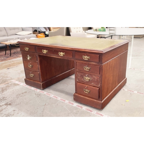 135 - PEDESTAL DESK, Edwardian mahogany with green leather top above nine drawers on castors, 76cm H x 153... 