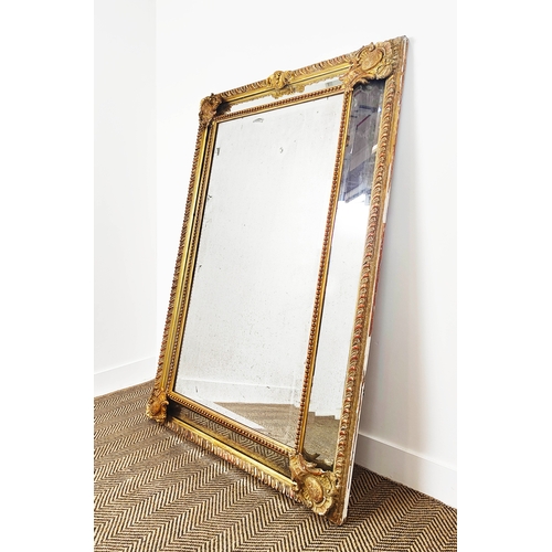 173 - WALL MIRROR, 19th century French giltwood and gesso with gadrooned cushion frame, 155cm x 101cm.