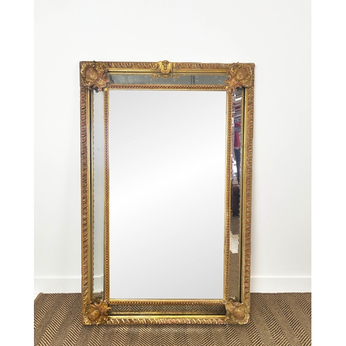 173 - WALL MIRROR, 19th century French giltwood and gesso with gadrooned cushion frame, 155cm x 101cm.