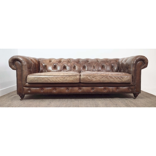 176 - CHESTERFIELD SOFA, brown leather on front castors, 73cm H x 223cm W x 100cm D.