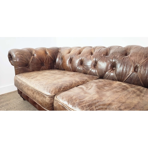 176 - CHESTERFIELD SOFA, brown leather on front castors, 73cm H x 223cm W x 100cm D.