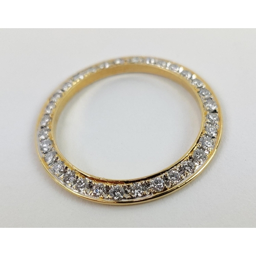 17 - AN 18CT YELLOW GOLD DIAMOND SET WATCH BEZEL, encrusted with round brilliant cut diamonds, approximat... 