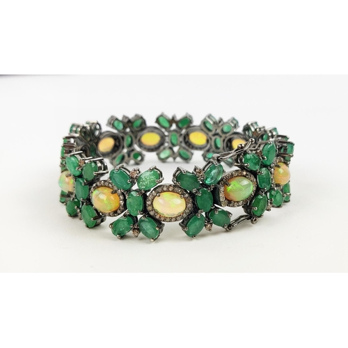 19 - A LARGE EMERALD, OPAL AND DIAMOND SET BRACELET, set with oval opals, emeralds, and round brilliant c... 