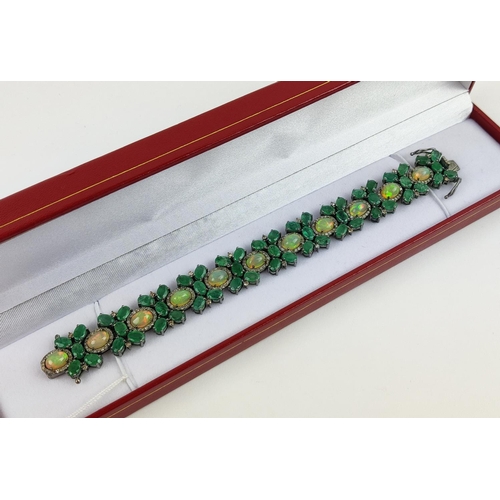 19 - A LARGE EMERALD, OPAL AND DIAMOND SET BRACELET, set with oval opals, emeralds, and round brilliant c... 