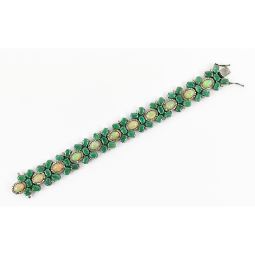 19 - A LARGE EMERALD, OPAL AND DIAMOND SET BRACELET, set with oval opals, emeralds, and round brilliant c... 