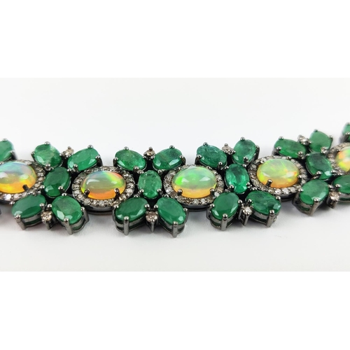 19 - A LARGE EMERALD, OPAL AND DIAMOND SET BRACELET, set with oval opals, emeralds, and round brilliant c... 