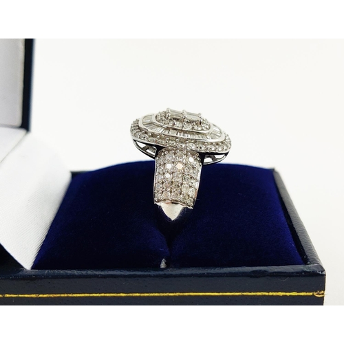 20 - A WHITE GOLD DIAMOND CLUSTER GENTS RING, 9ct gold shank, baguette cut and round brilliant cut stones... 