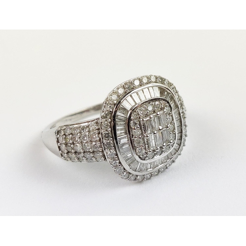 20 - A WHITE GOLD DIAMOND CLUSTER GENTS RING, 9ct gold shank, baguette cut and round brilliant cut stones... 