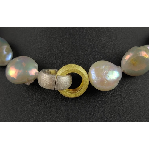 21 - A BAROQUE FRESHWATER PEARL NECKLACE, with brushed gold plated hoop clasp, 44cm / 17.5 inches long.