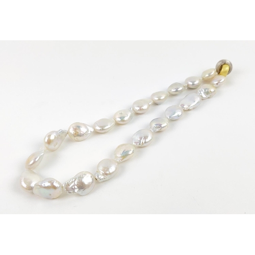 21 - A BAROQUE FRESHWATER PEARL NECKLACE, with brushed gold plated hoop clasp, 44cm / 17.5 inches long.