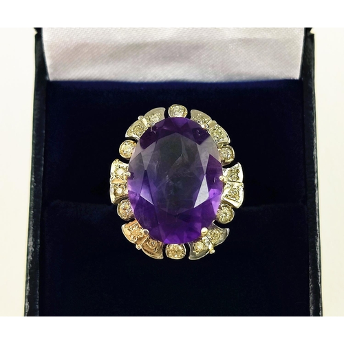 22 - AN AMETHYST AND DIAMOND DRESS RING, 9ct yellow gold shank, white gold mount, the large central mixed... 