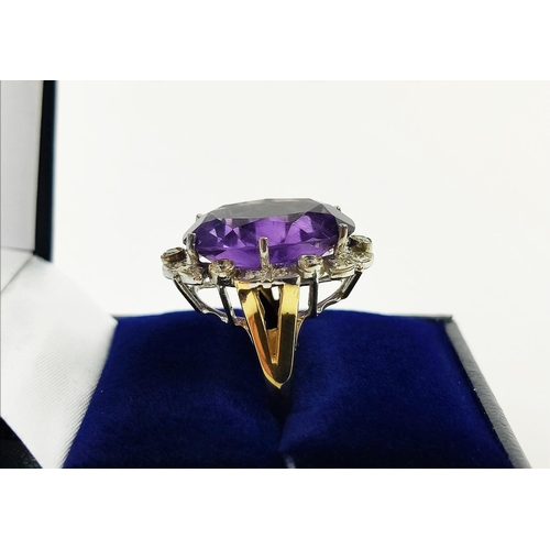 22 - AN AMETHYST AND DIAMOND DRESS RING, 9ct yellow gold shank, white gold mount, the large central mixed... 