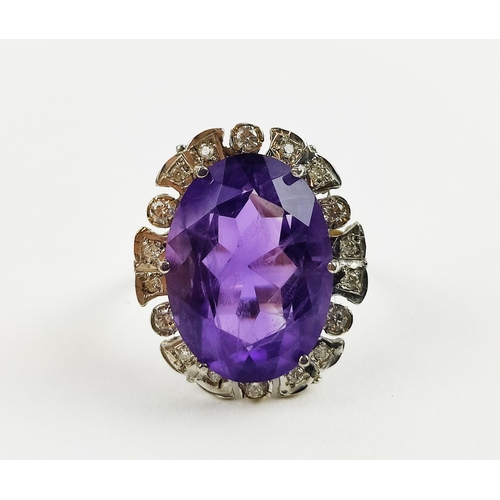 22 - AN AMETHYST AND DIAMOND DRESS RING, 9ct yellow gold shank, white gold mount, the large central mixed... 