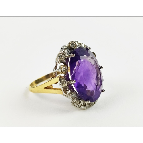 22 - AN AMETHYST AND DIAMOND DRESS RING, 9ct yellow gold shank, white gold mount, the large central mixed... 