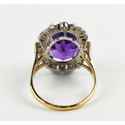 22 - AN AMETHYST AND DIAMOND DRESS RING, 9ct yellow gold shank, white gold mount, the large central mixed... 