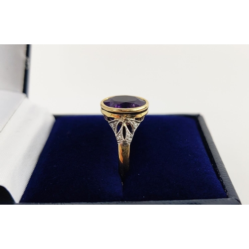 23 - A YELLOW METAL AMETHYST AND DIAMOND DRESS RING, early 20th century, likely to be high carat gold, th... 