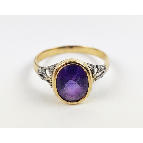 23 - A YELLOW METAL AMETHYST AND DIAMOND DRESS RING, early 20th century, likely to be high carat gold, th... 