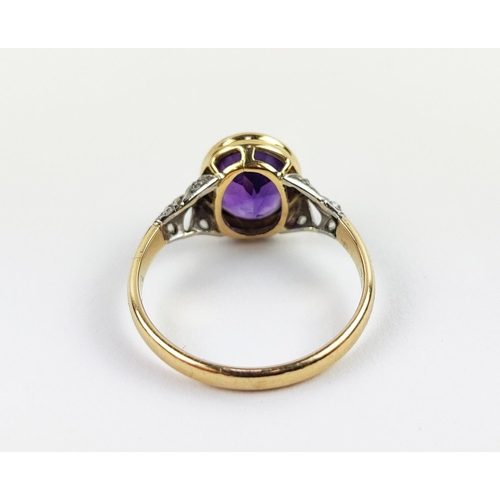 23 - A YELLOW METAL AMETHYST AND DIAMOND DRESS RING, early 20th century, likely to be high carat gold, th... 