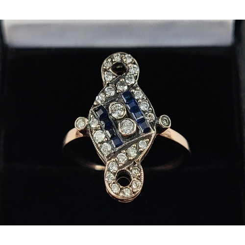 29 - AN ART NOUVEAU STYLE DRESS RING, rose gold coloured metal, set with diamonds and sapphires, ring siz... 